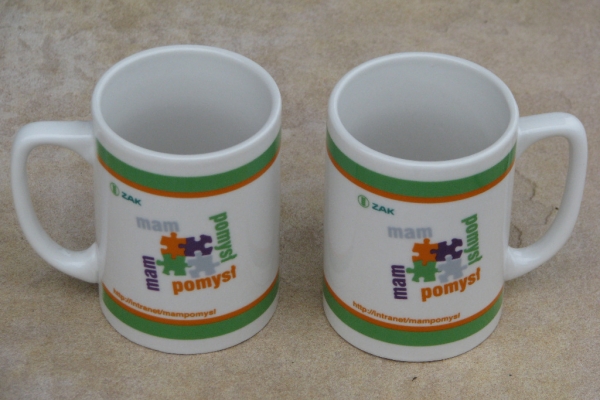 Ogłoszenie - Pamiątkowy kubek porcelanowy ZAK SA z motywem puzzli. Zdjęcie 1