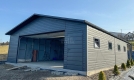 Ogłoszenie - Garaż blaszany 8x8m + wiata 2m - brama segmentowa - drzwi - 4x okno - antracyt - rynny - dach dwuspadowy TS1146. Miniaturka 2