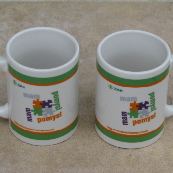 Ogłoszenie - Pamiątkowy kubek porcelanowy ZAK SA z motywem puzzli